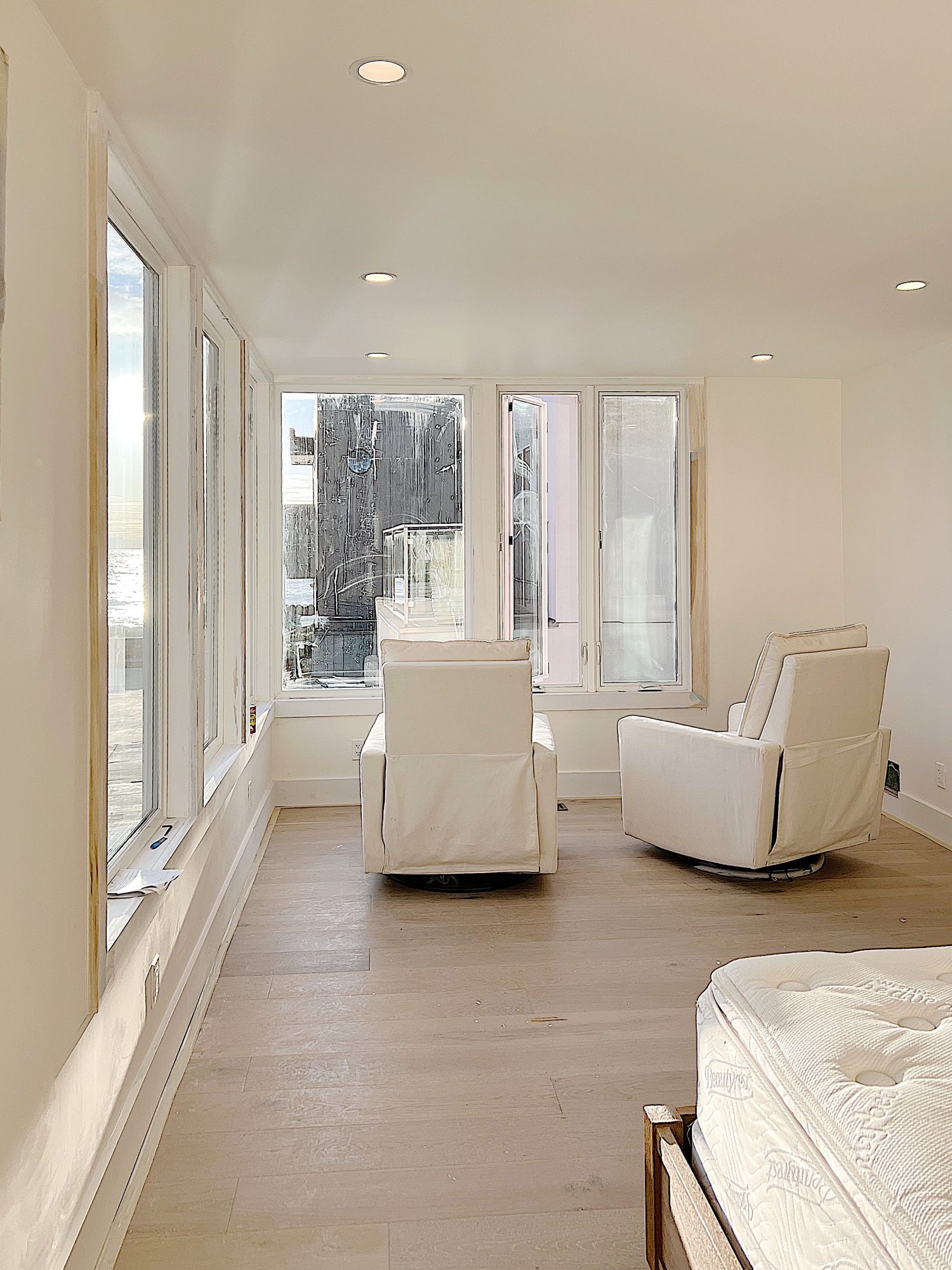 A flooring remodel used the existing hardwood floors and new engineered hardwood.