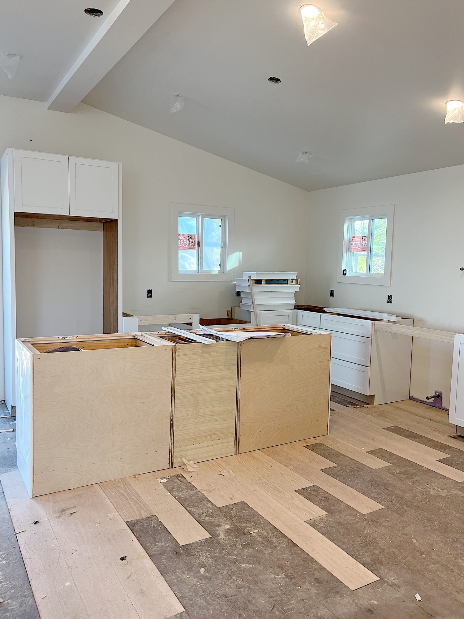 A flooring remodel used the existing hardwood floors and new engineered hardwood.