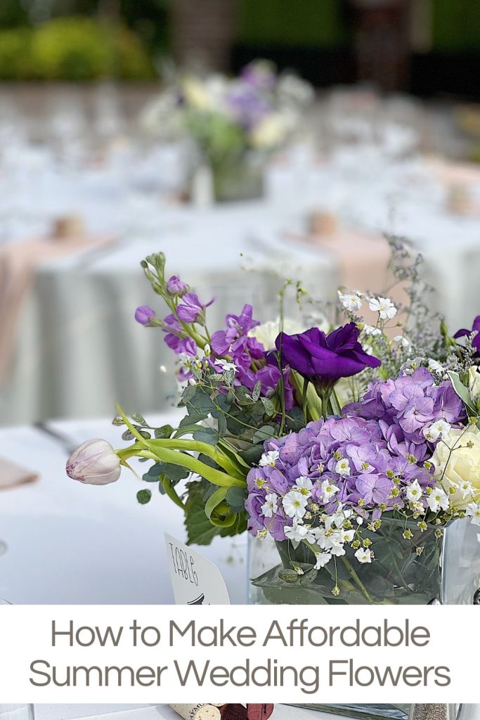 Homemade flowers for a wedding using purple and white flowers in glass vases.