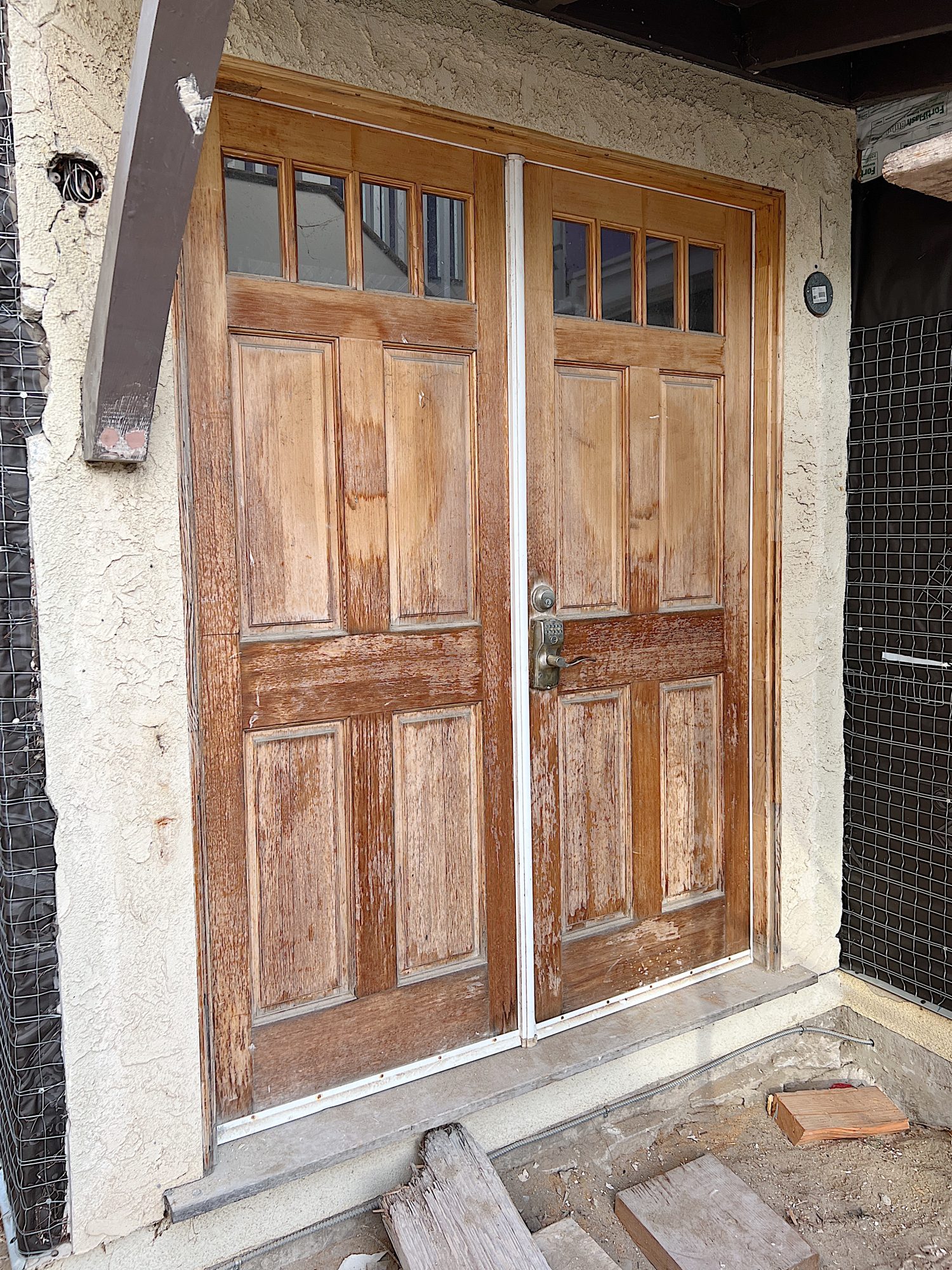 The modern black front door made from fiberglass at the beach house.