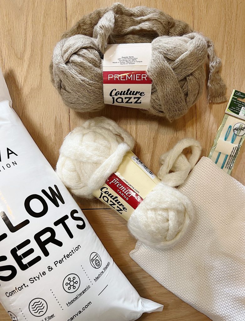 Materials needed to make a handmade monk cloth pillow with yarn