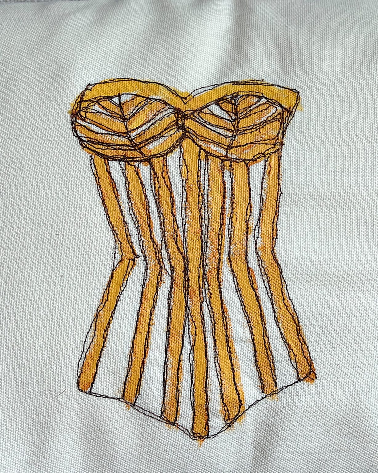 DIY pillow featuring painted and stitched vintage bathing suites in a modern coastal vintage style.