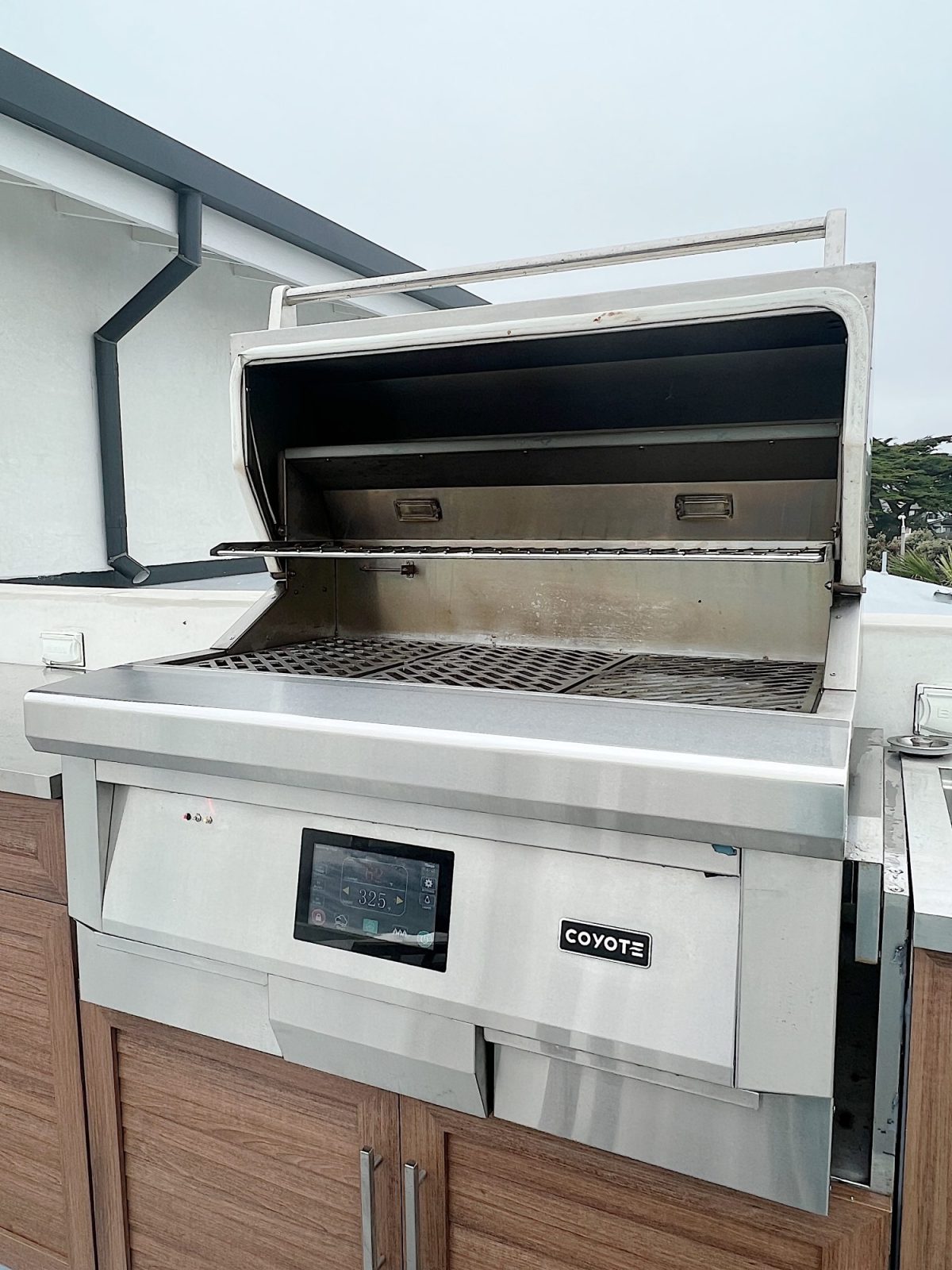 An electric pellet Grill which actually grills, smokes, bakes, and sears that is located on our third floor deck.