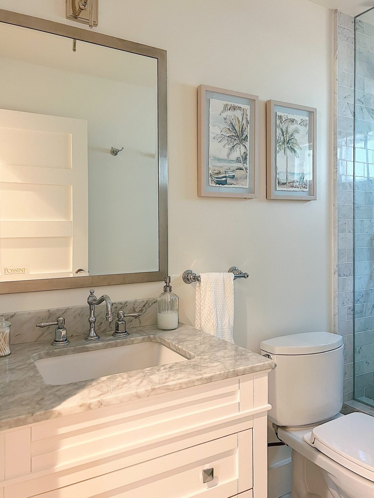A newly constructed en suite bathroom with a step in steam shower 9with tub), single marble vanity and decor.
