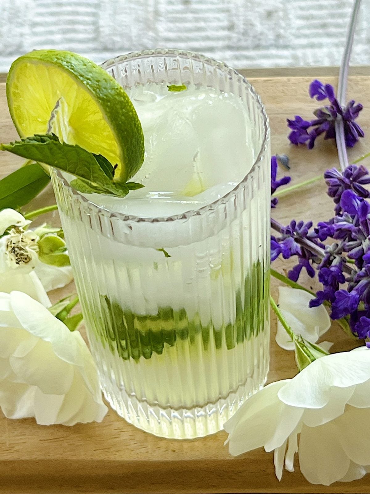 A freshly made Mojito Refreshing Summer Mocktail with a garnish of fresh mint and a lime slice.