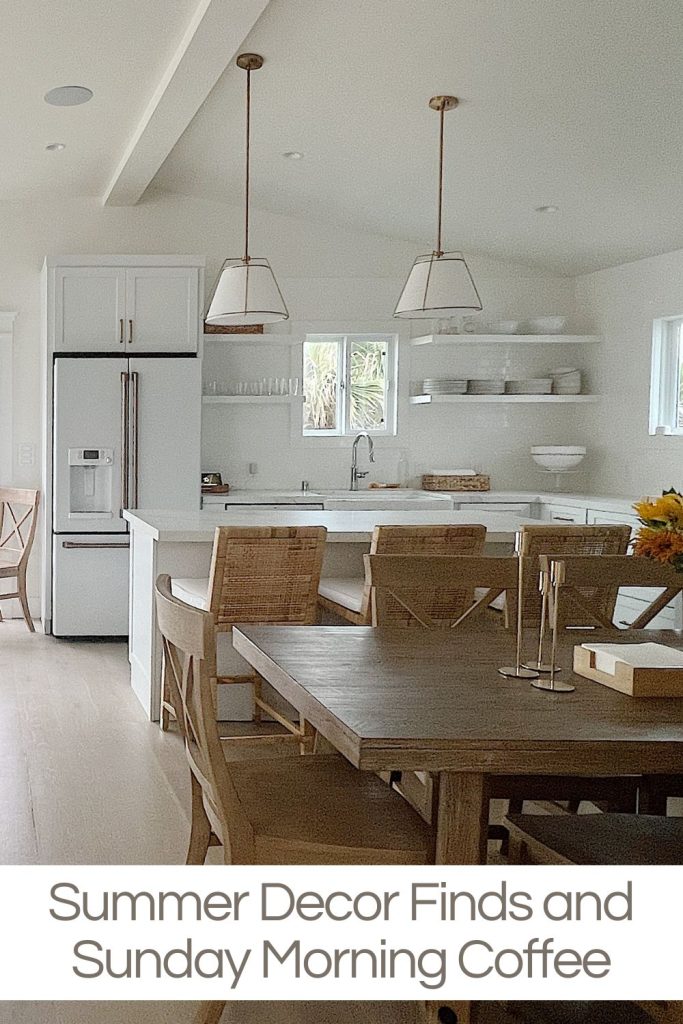 The beach house kitchen and family room with light wood decor and white cabinets, countertops, and appliances.