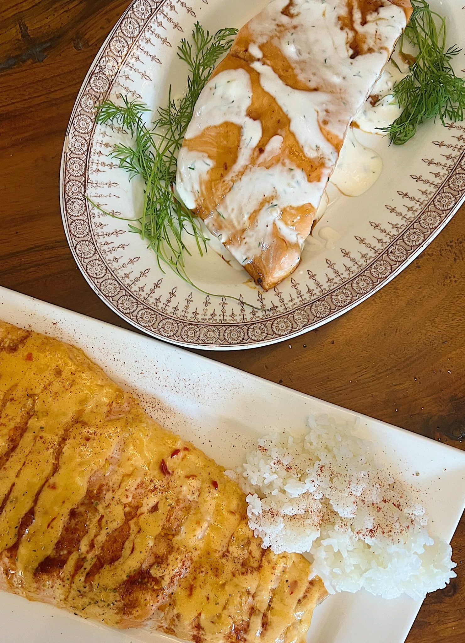 Two plates of salmon including pellet grilled honey salmon with lemon dill sauce and bang bang salmon.