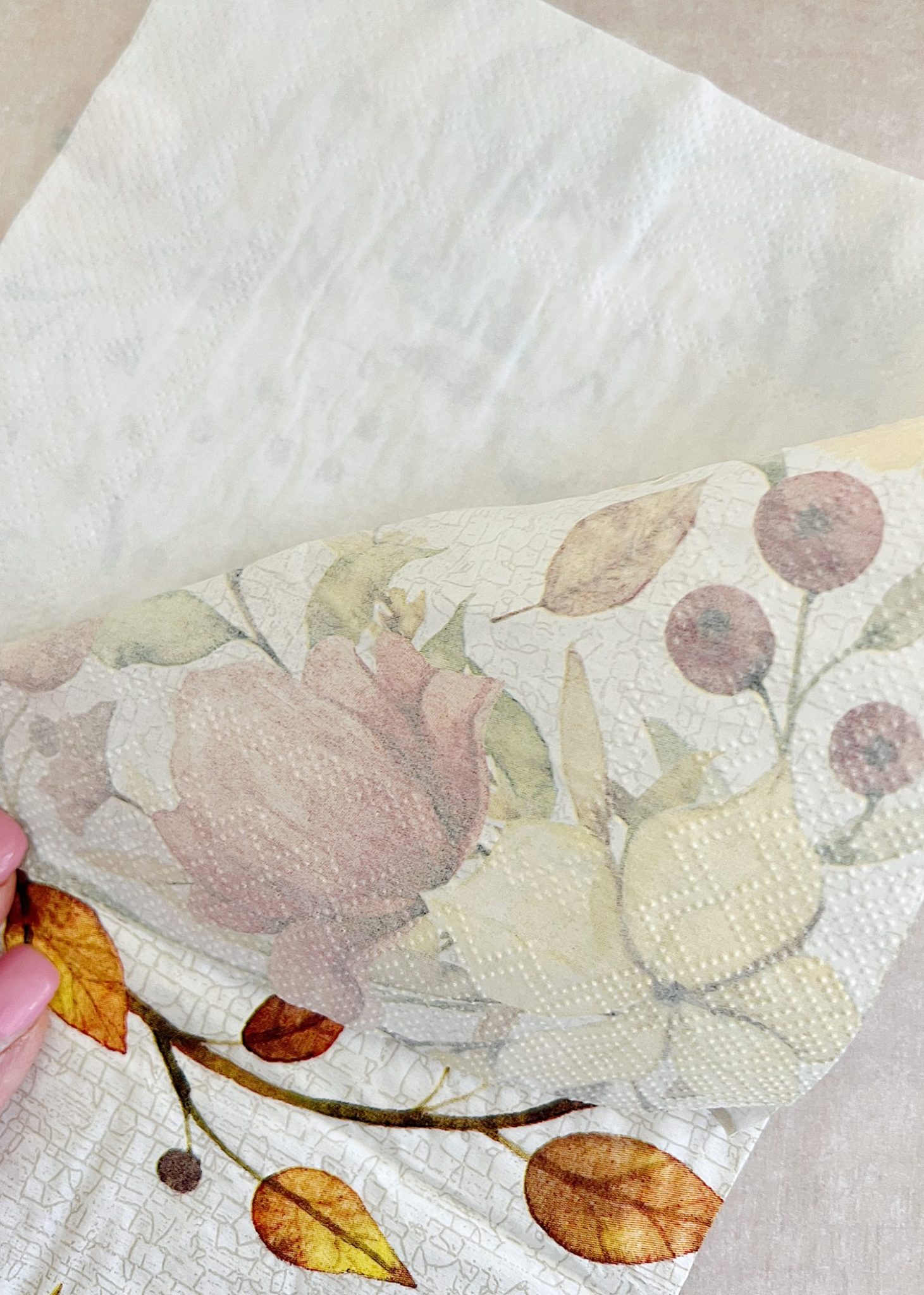 How to cover a terra cotta pot with a paper napkin.