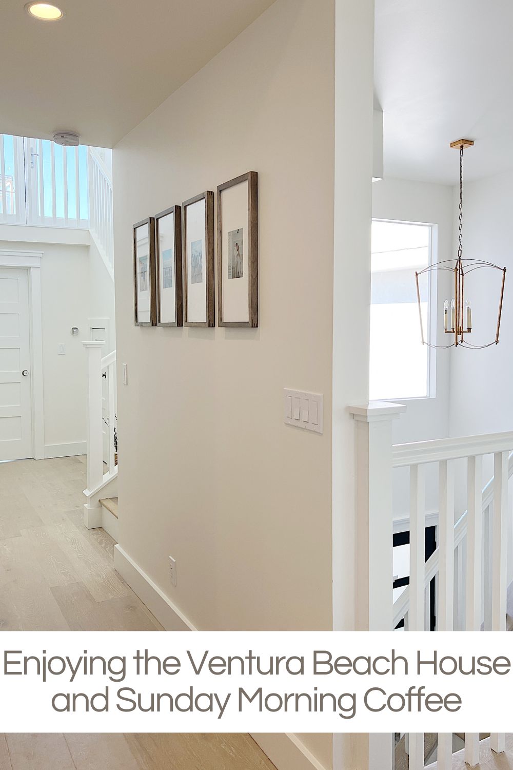 A hallway at our beach house featuring four wood framed prints.
