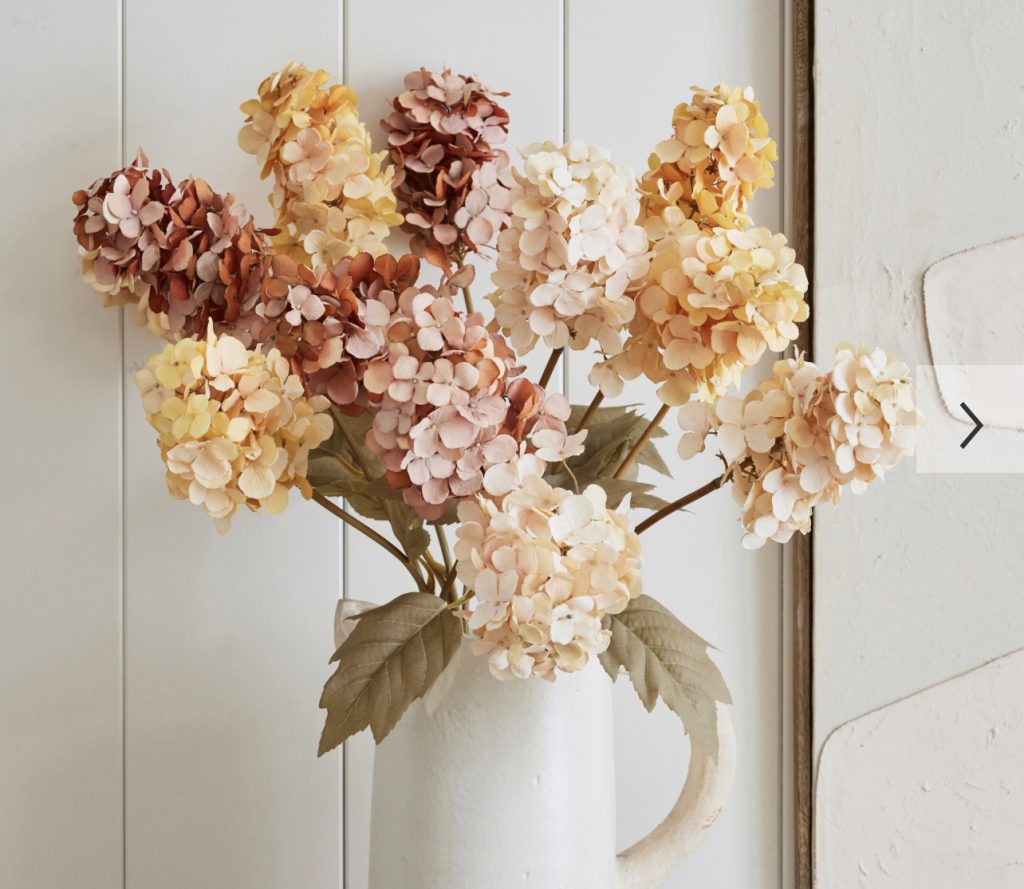Fall home decor inspiration photos with hydrangeas in a white vase.