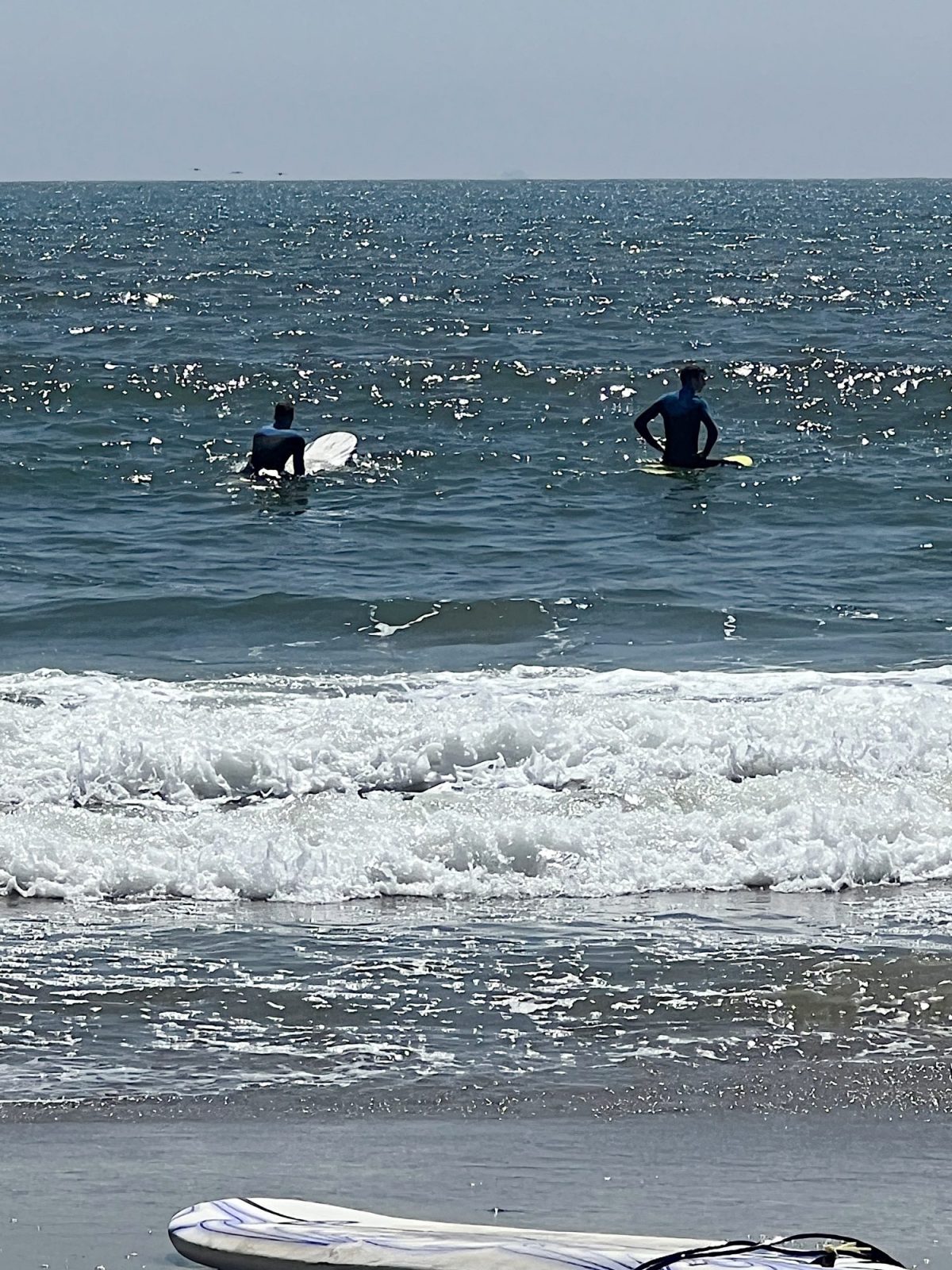 Michael and Matt in the ocean waiting for waves to surf