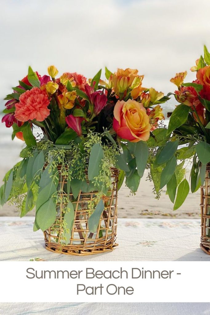 Arranging flowers and a table for a dinner on the beach.
