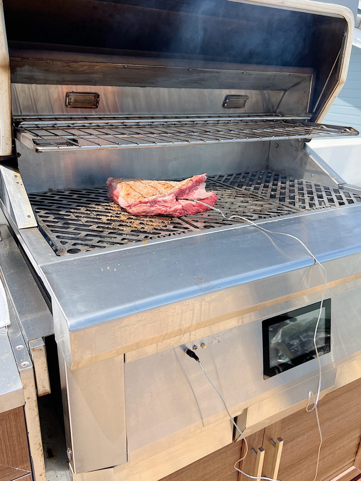 Grilling a smoked brisket with a homemade rub.