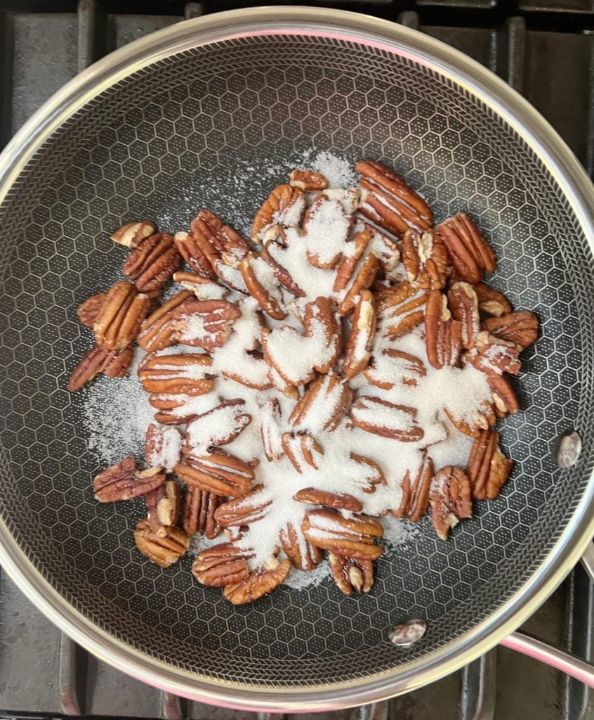 Making homemade candied pecans.