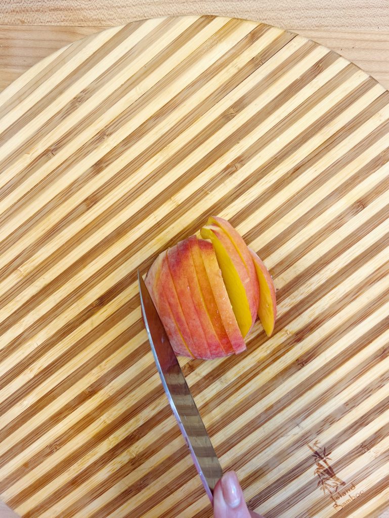 Slicing a peach.