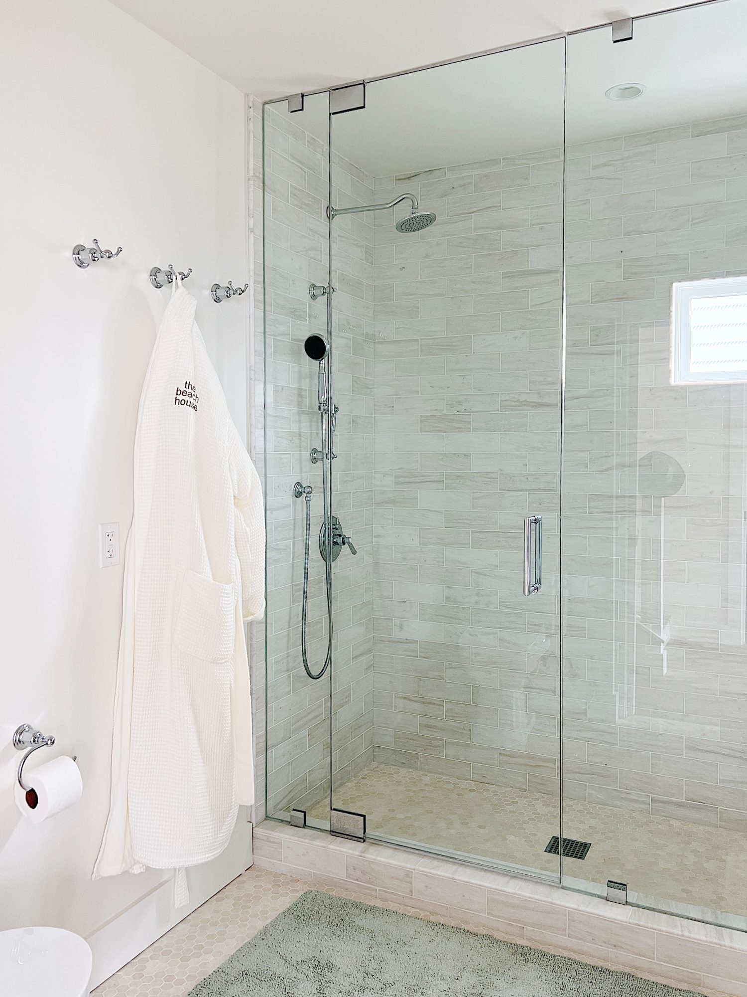 Our primary bathroom with a walk in shower and California faucets and hardware.