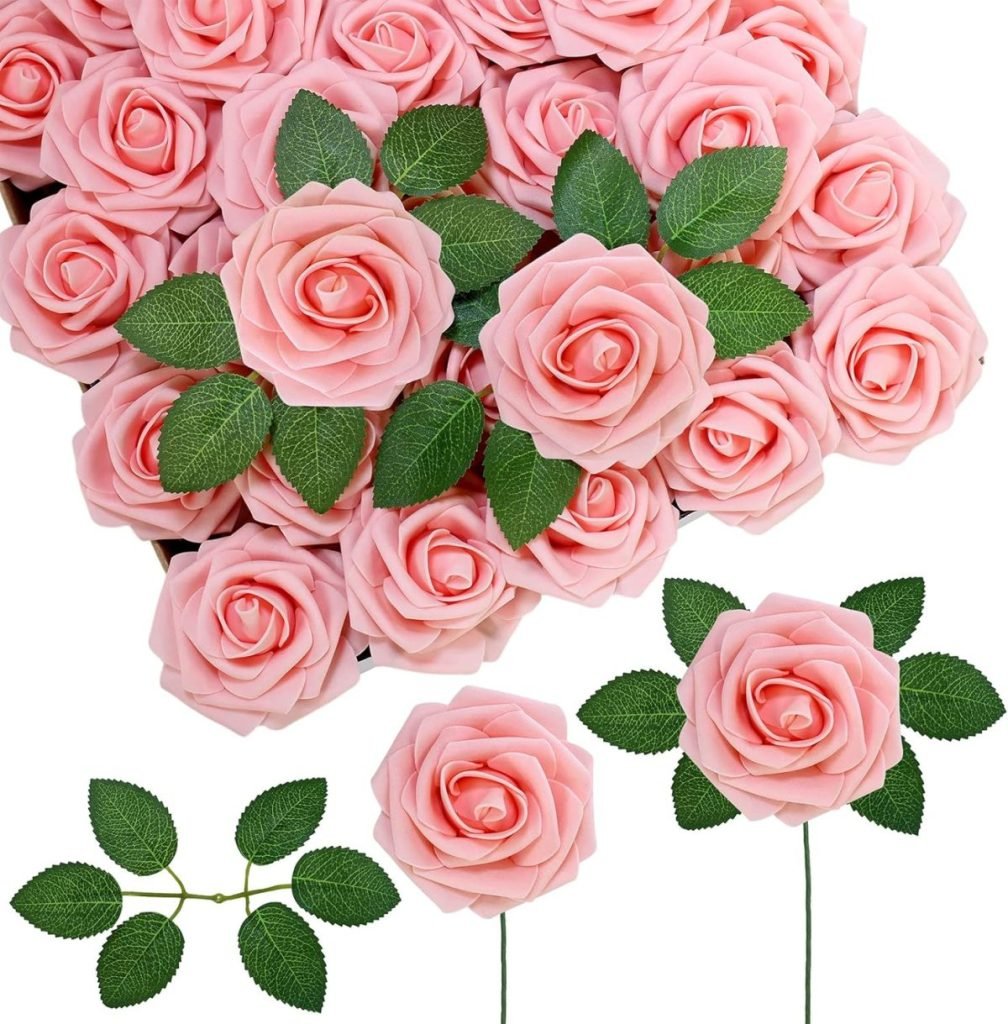 A bouquet of pink roses with green leaves, consisting of fresh, fully bloomed flowers, makes for elegant fall table decor ideas.