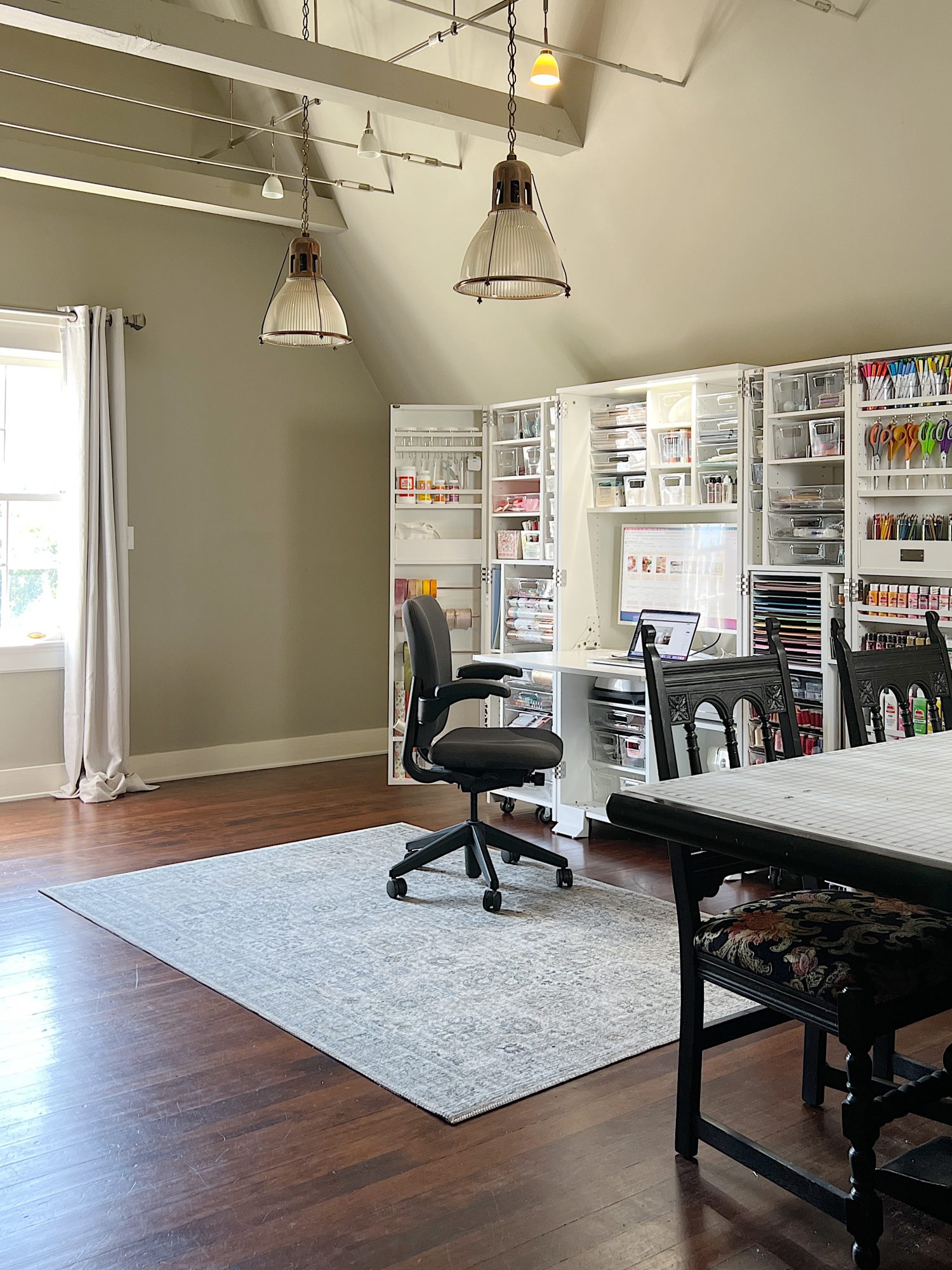 My new craft room on the third floor with vaulted ceilings, a Dreambox craft storing cabinet, a work table, and more.