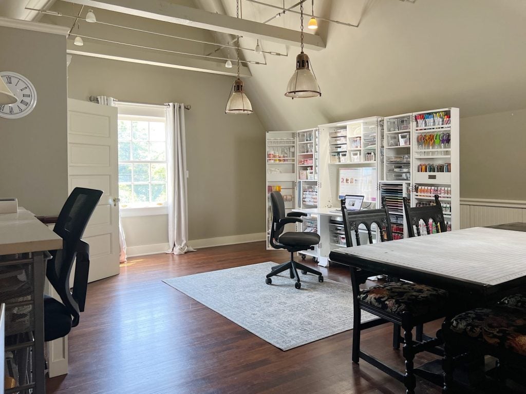 My new craft room on the third floor with vaulted ceilings, a Dreambox craft storing cabinet, a work table, and more.