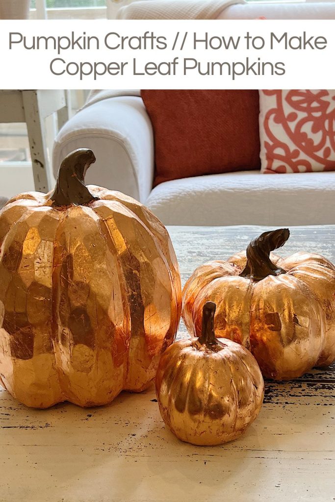 Three faux pumpkins covered with copper foil leaf.