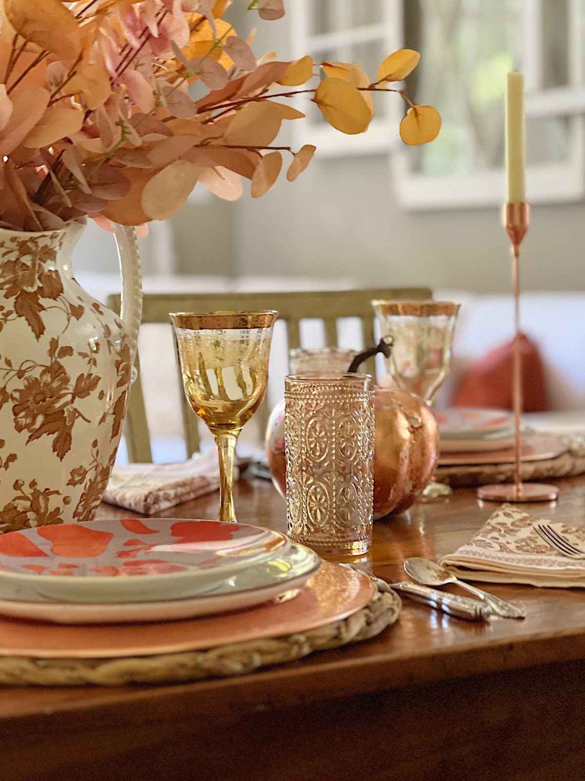 Decorating our family room with peach, pink, and copper repurposed and recycled fall decor.