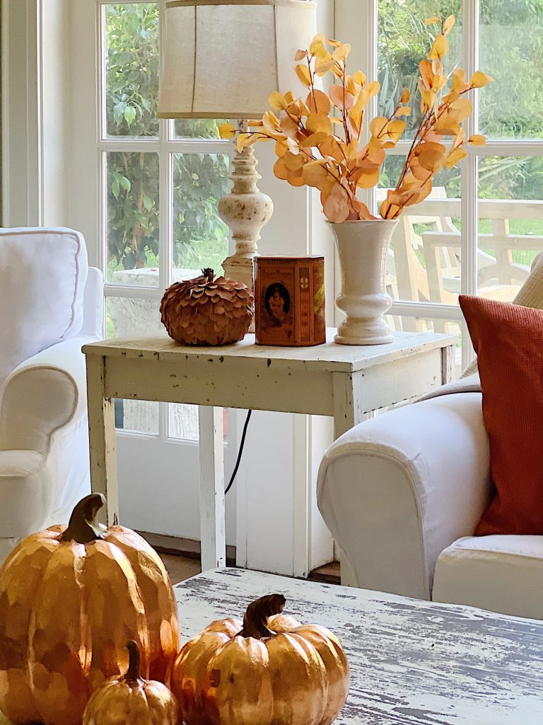 Decorating our family room with peach, pink, and copper repurposed and recycled fall decor.