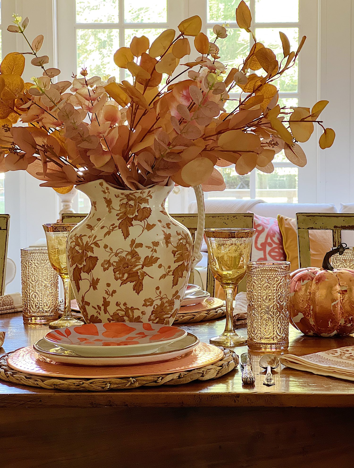 Decorating our family room with peach, pink, and copper repurposed and recycled fall decor.