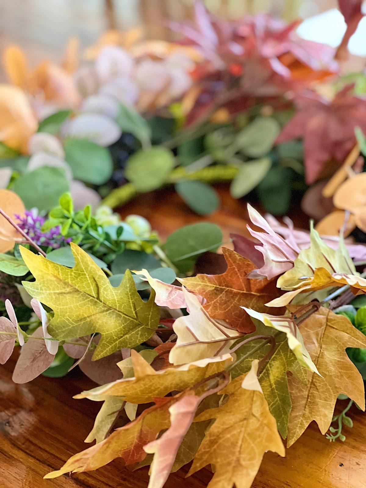 Decorating our family room with peach, pink, and copper repurposed and recycled fall decor.