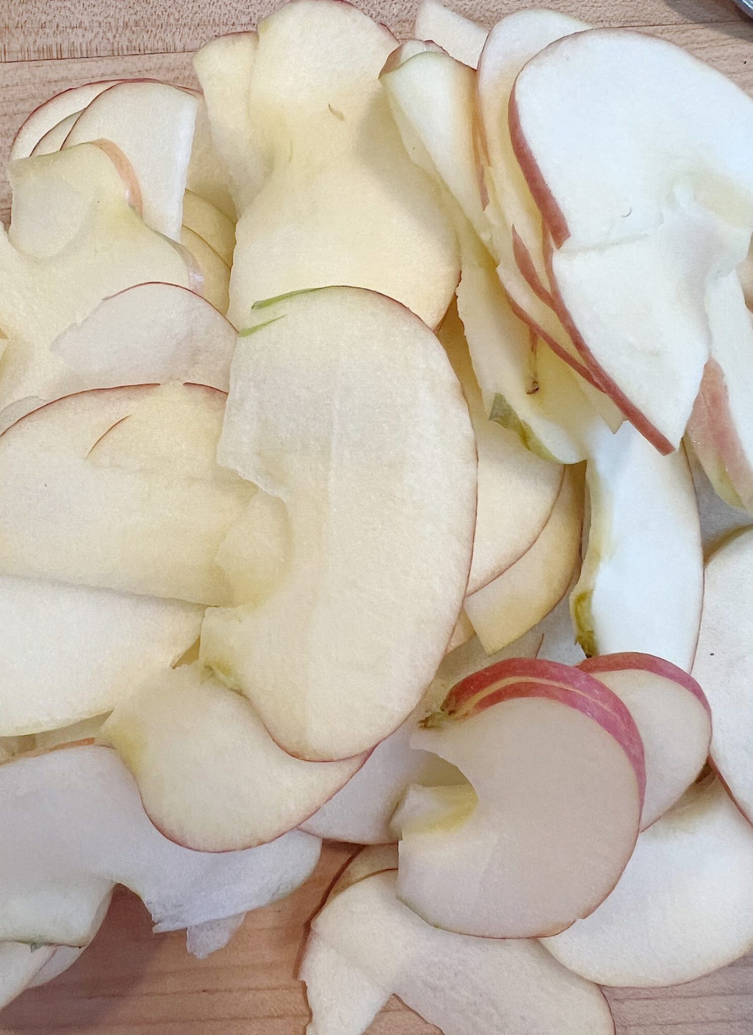 Homemade apple rose tartlets with caramel.