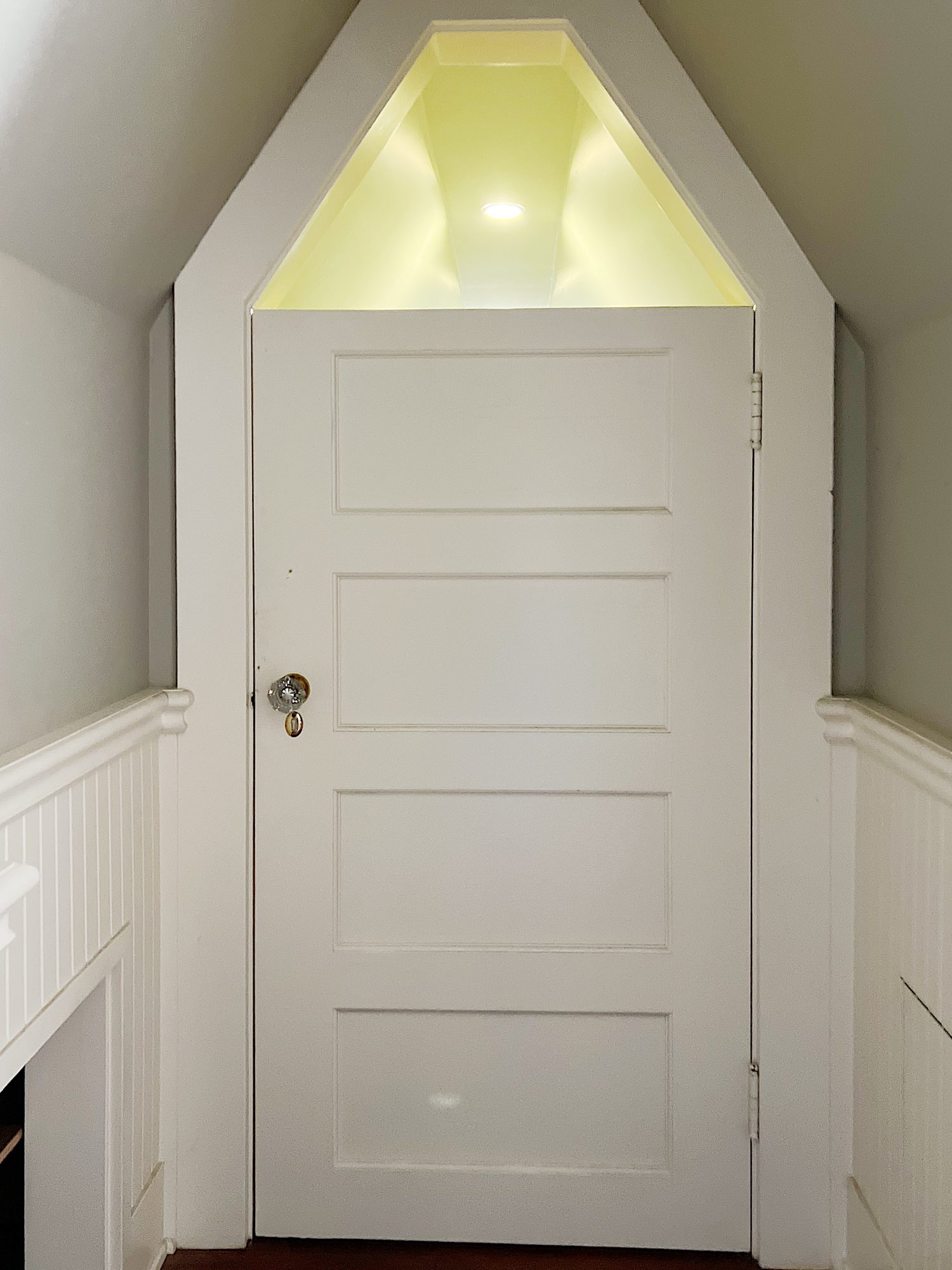 A closet in the eaves of our third floor that stores all of my craft supplies.