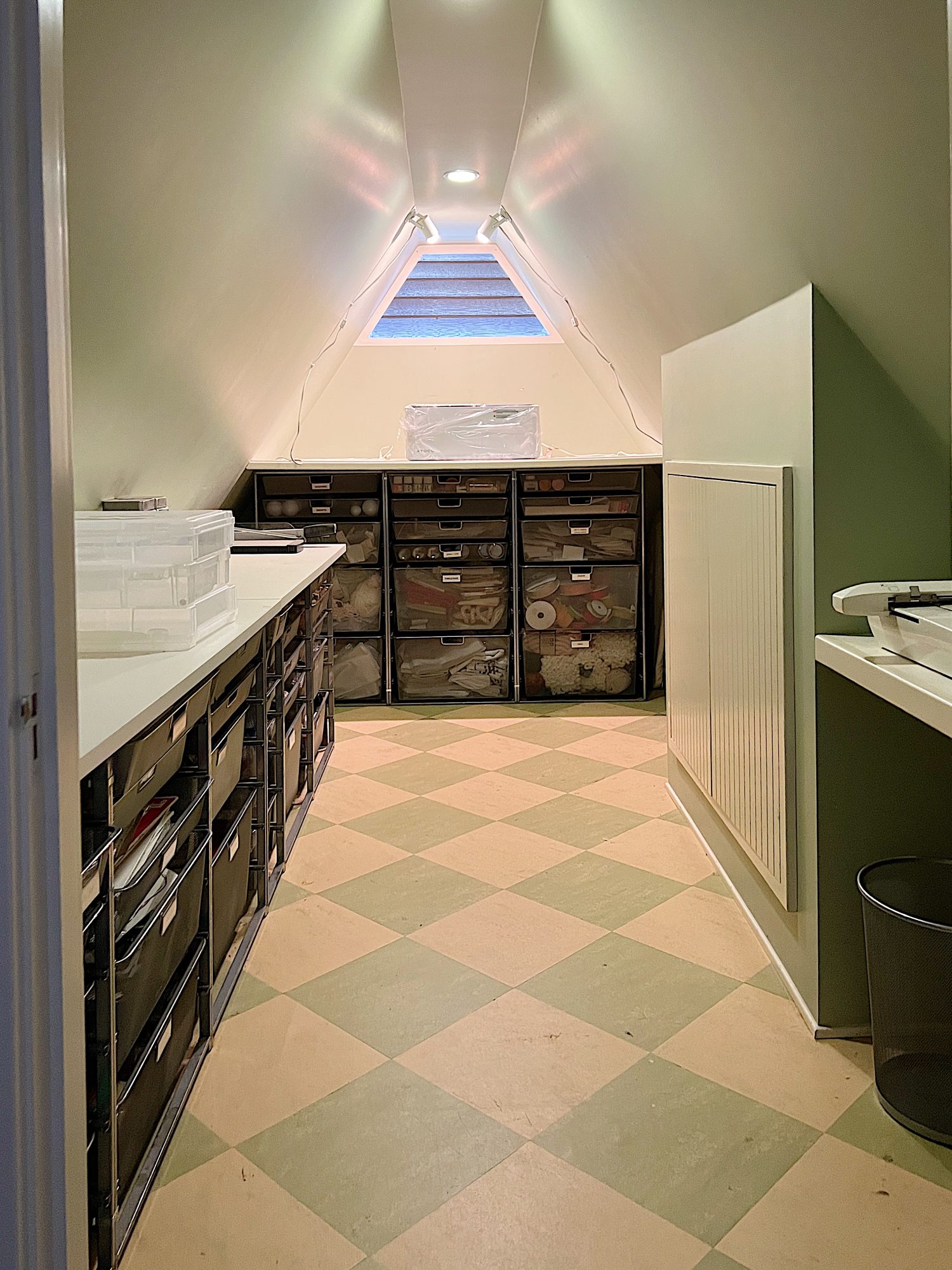 A closet in the eaves of our third floor that stores all of my craft supplies.
