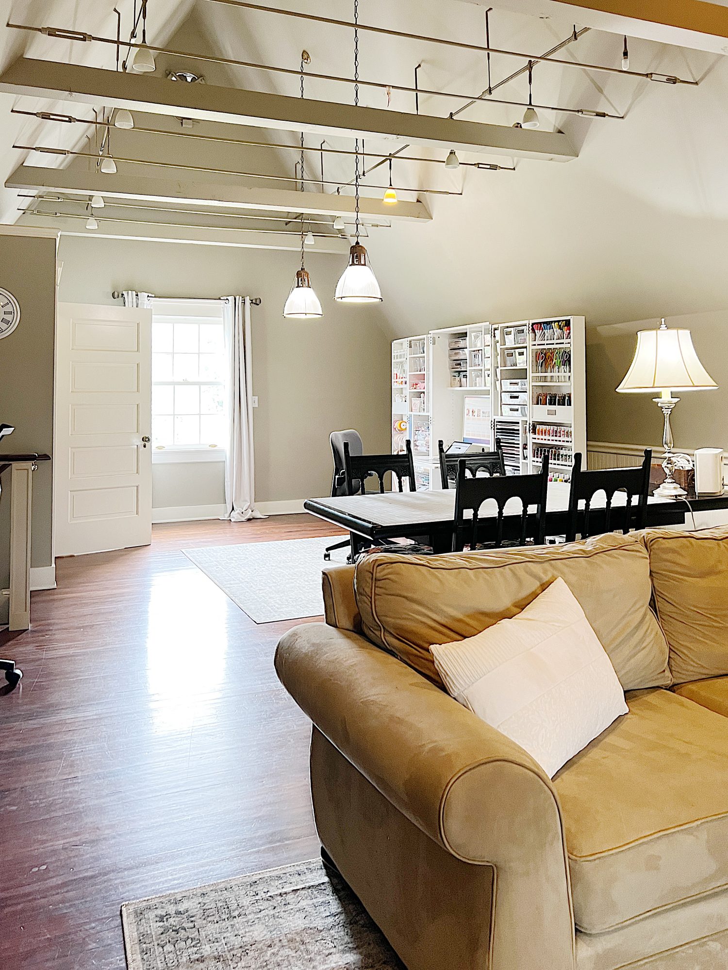 My new craft room on the third floor with vaulted ceilings, a Dreambox craft storing cabinet, a work table, and more.