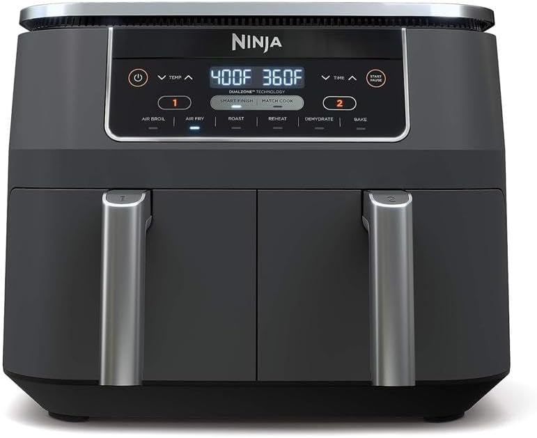 A black Ninja dual-zone air fryer with stainless steel handles, reminiscent of a Halloween wreath, showcases two temperature settings—400°F and 360°F—and an array of buttons for various cooking functions.