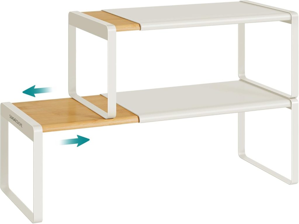 Two-tier shelf with a sliding wooden bottom tier and white metal frame—an innovative addition for those seeking smart Pantry Cabinet Ideas, as shown by arrows indicating the outward movement of the bottom shelf.