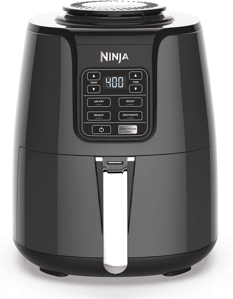 A black Ninja air fryer with a digital display showing 400°F, perfect for crafting Halloween treats. The control panel includes buttons for temperature, time, air fry, roast, reheat, dehydrate, and start/pause.