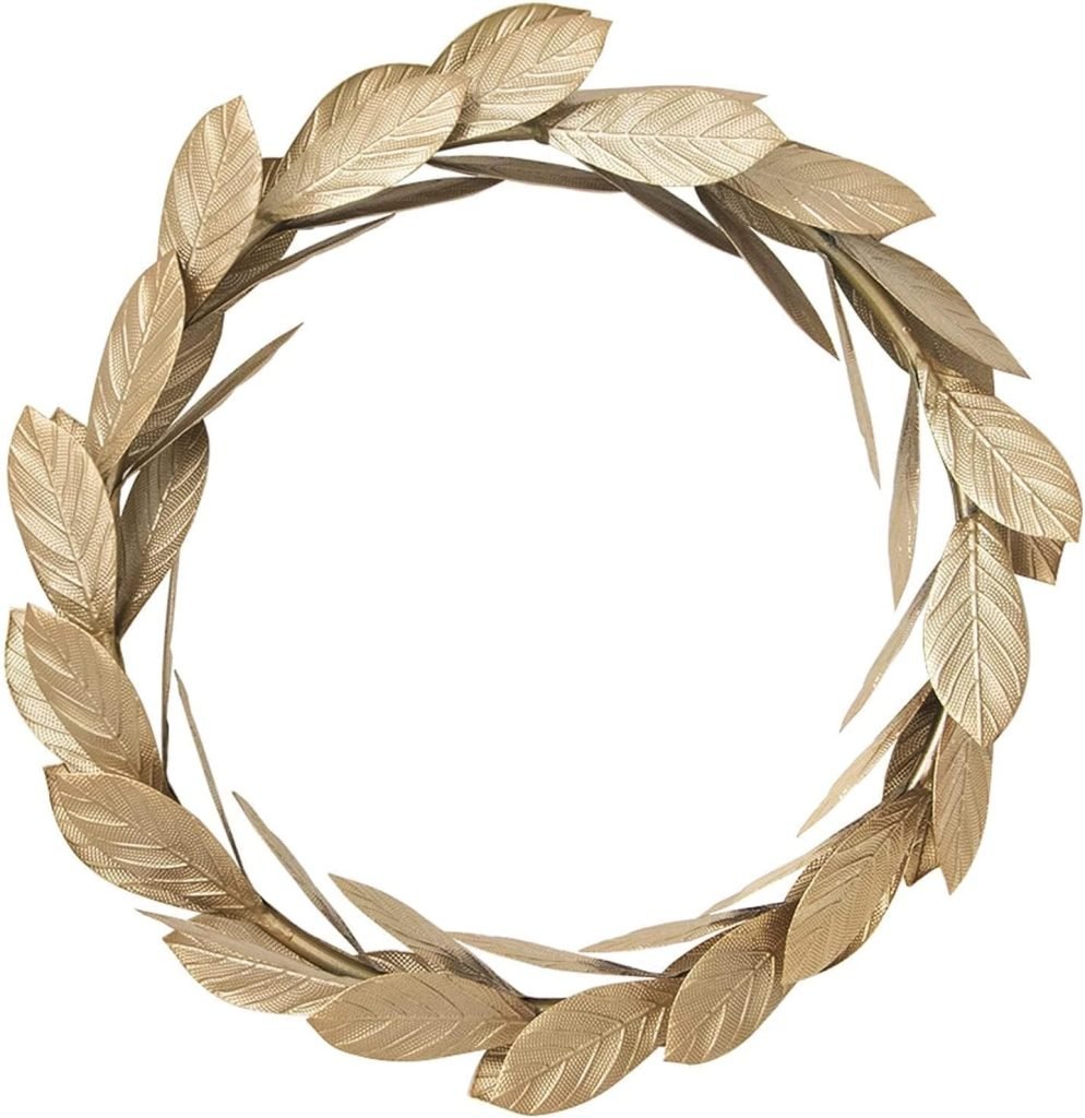 A gold laurel wreath with detailed leaf patterns arranged in a circular shape makes an elegant addition to wreaths for fall.