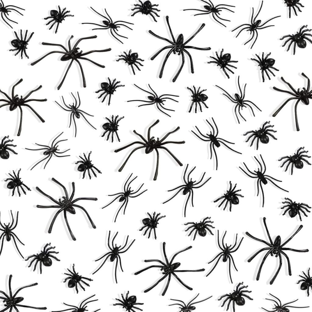 A pattern of black spiders of various sizes spread evenly across a white background, reminiscent of a Halloween wreath.