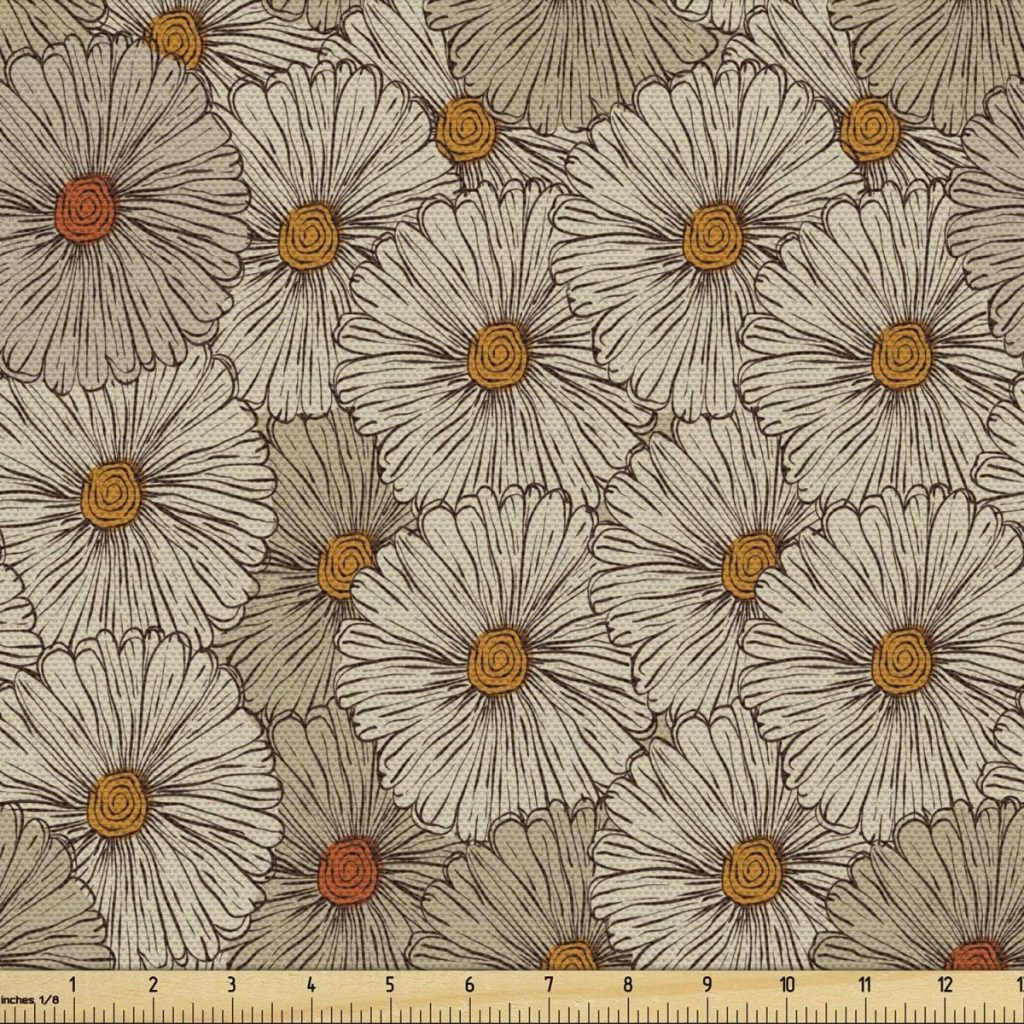 A fabric featuring a pattern of beige and orange flowers with a ruler at the bottom for scale, perfect for adding a touch of fall pumpkins to your projects.