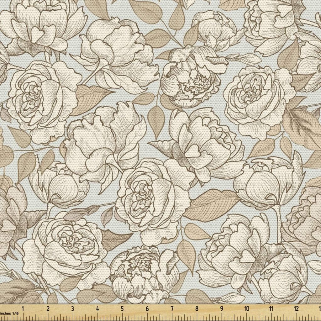 A fabric pattern featuring an intricate design of beige and ivory roses with leaves on a light blue background, accented by subtle fall pumpkins. A ruler at the bottom shows the scale.