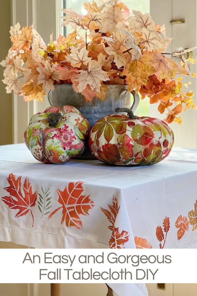 A handmade fall tablecloth using stencils and metallic paint.