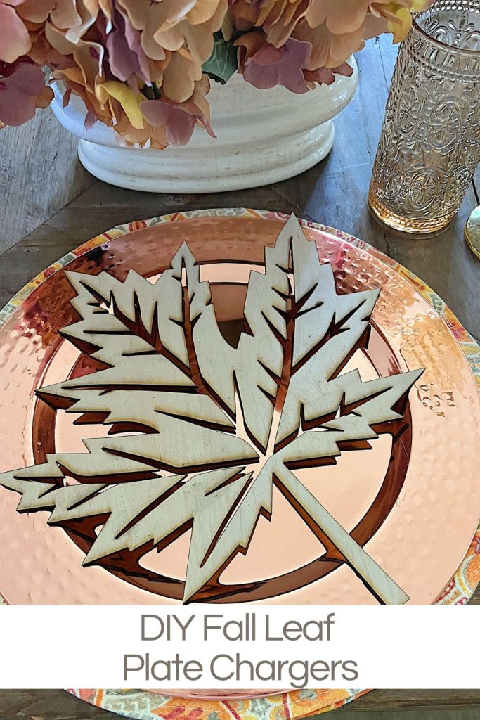 A fall themed table with a placemat, copper charger, amber glassware and a fall leaf wood charger cut with a laser cutting machine.