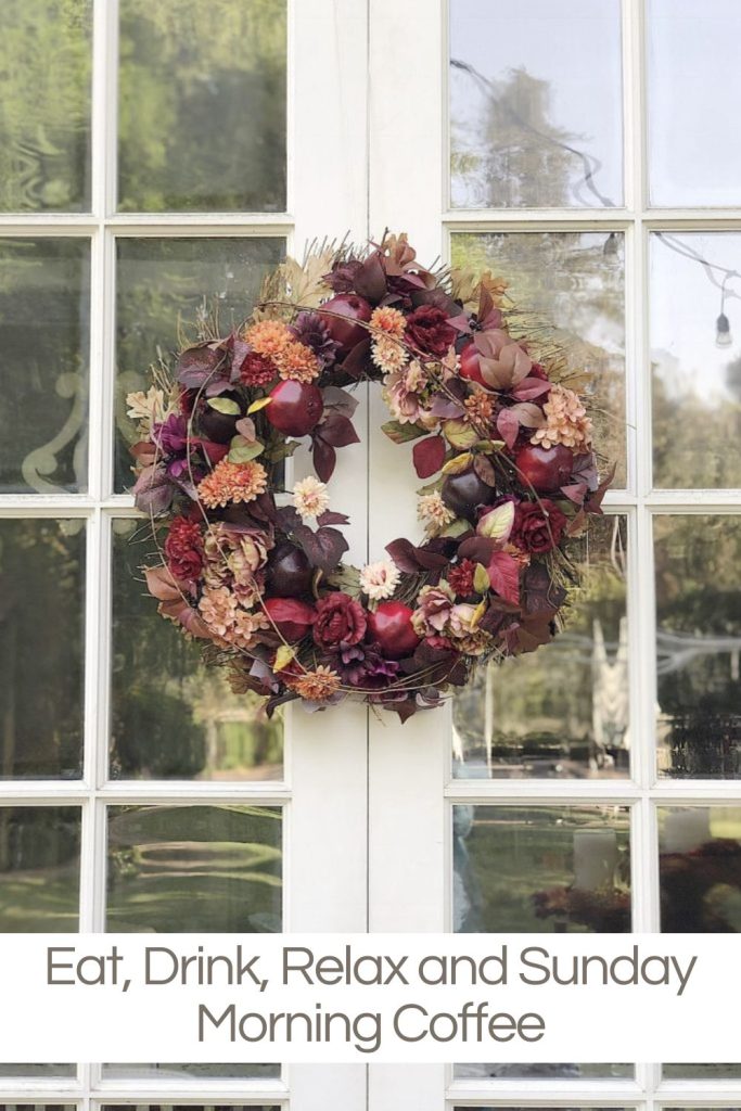 A fall wreath hanging on the back doors of our porch.