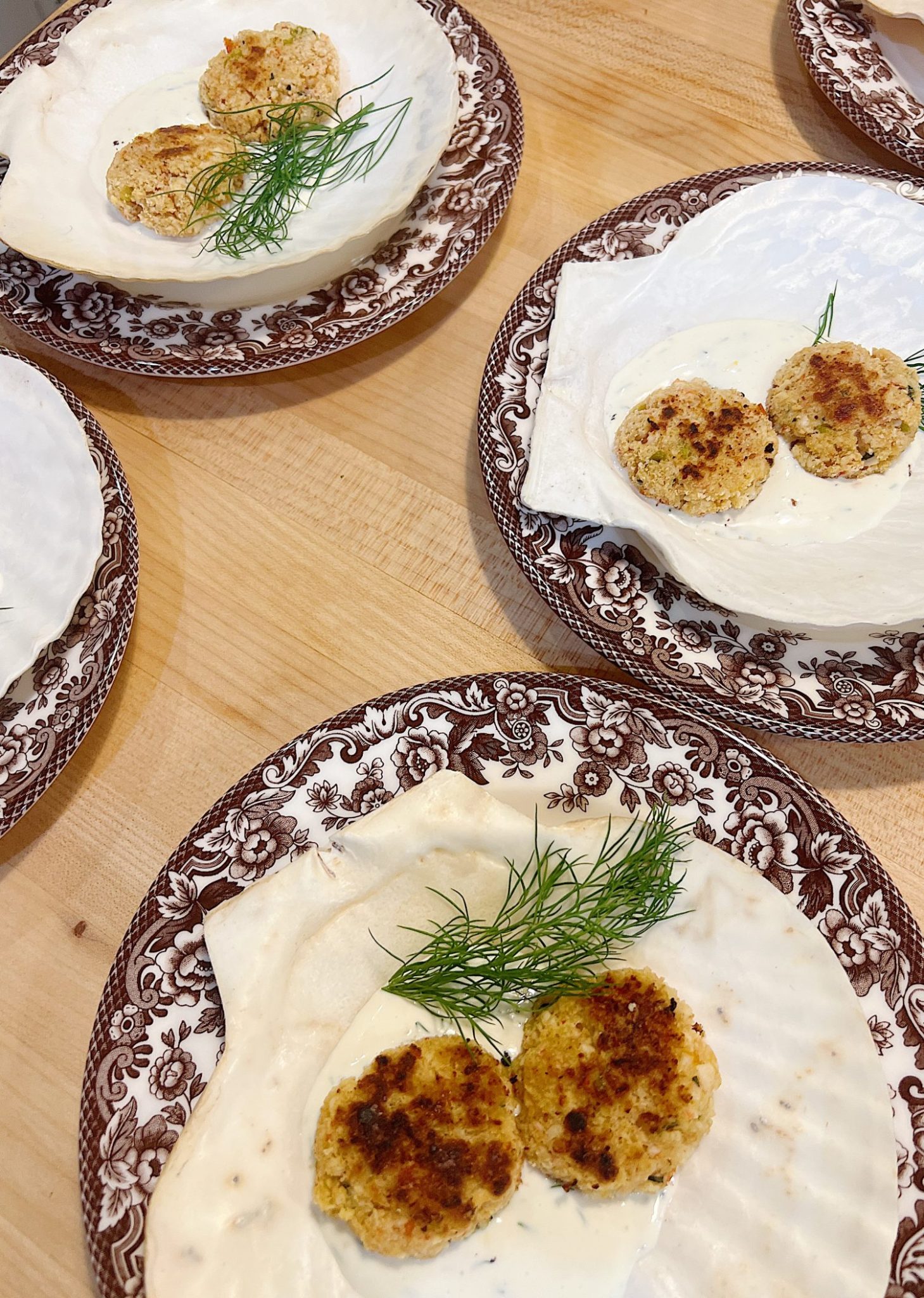 Cooking and plating the crab cakes for a dinner for eight which was planned and hosted by us to benefit charity.