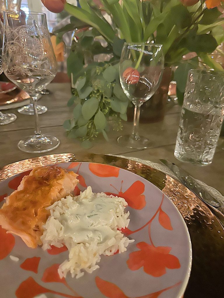 Serving the salmon, rice, and lemon dill sauce for a dinner for eight which was planned and hosted by us to benefit charity.