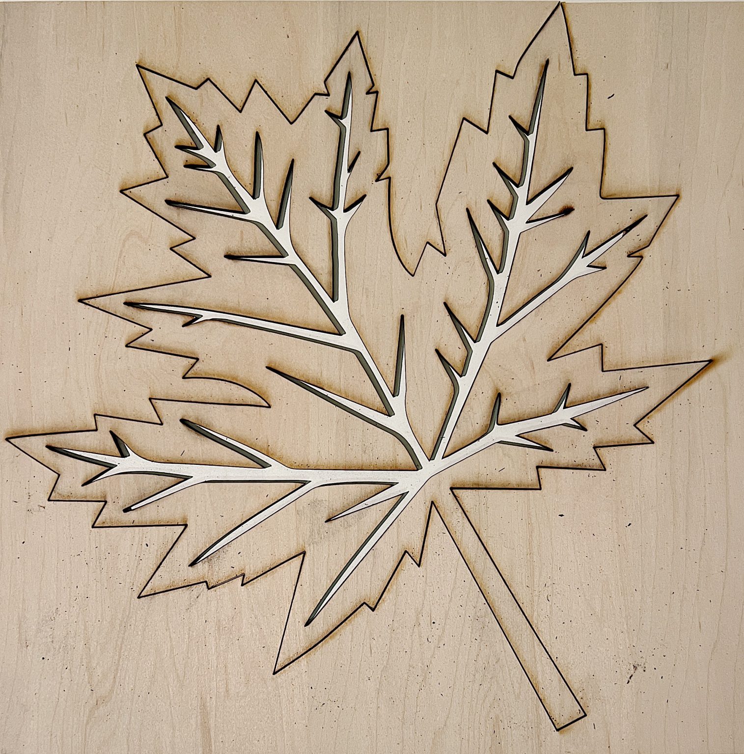 Designing and cutting a fall leaf wood charger with an xtool m1 laser cutting machine.