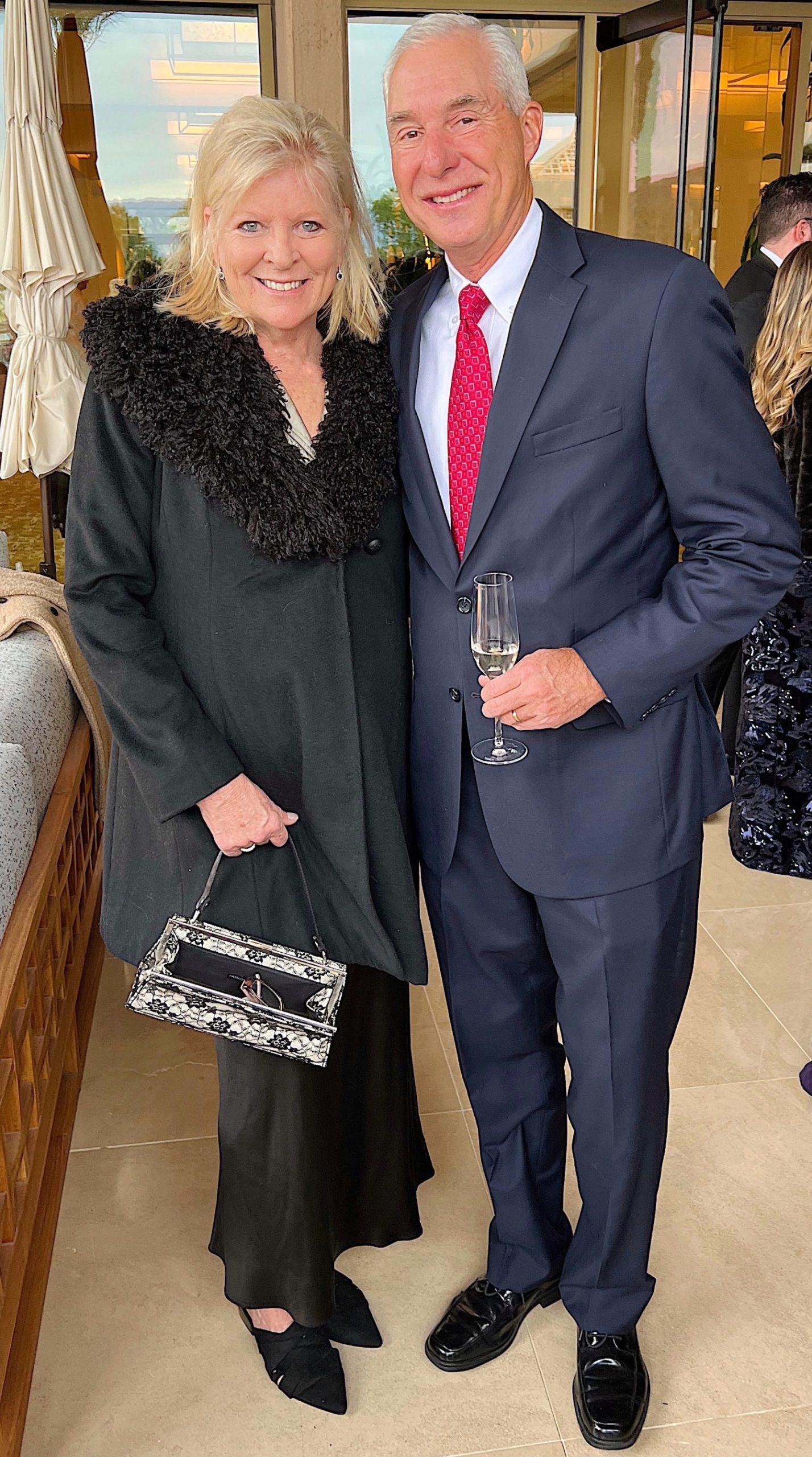 Dave and I at a weeing dressed in a balck coat, pants and a navy suit.