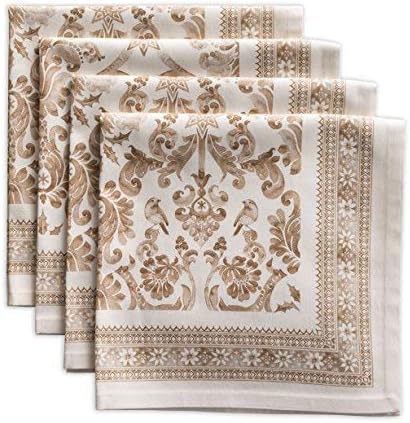 Four folded fabric napkins with a brown floral and geometric pattern on a light background, perfect for setting the table during cozy fall soup recipes.