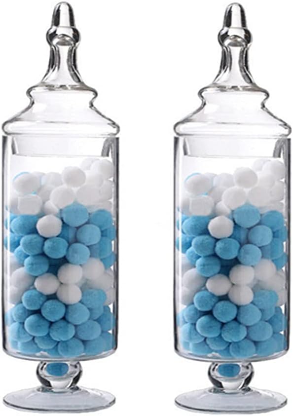 Two glass jars with lids, filled with white and blue cotton balls, perfect for storing your Halloween sugar cookies.