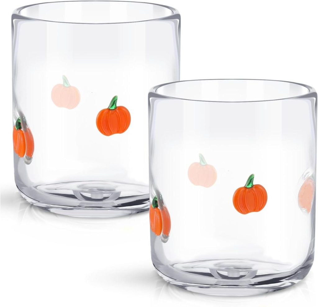 Two clear glass tumblers decorated with orange and light pink pumpkin illustrations—perfect for serving your favorite Pumpkin Trifle Recipe.