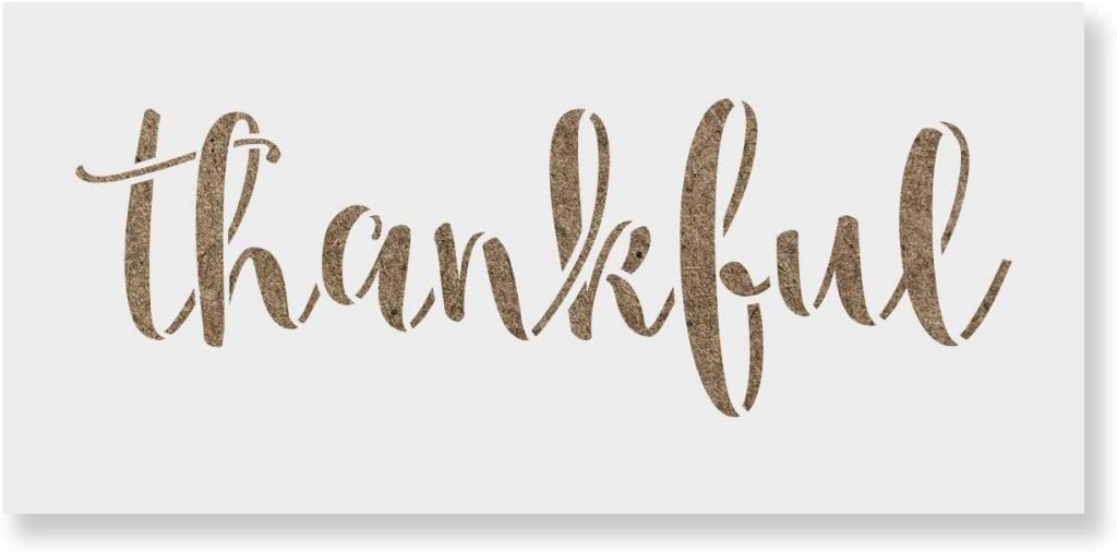 The word "thankful" is elegantly rendered in a decorative, cursive font, radiating a textured gold appearance against a white background, reminiscent of the rich hue of purple sweet potato.